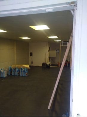 Empty room with cleaning supplies and tools