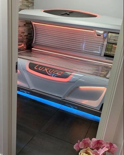 Luxura tanning bed with LED lighting in salon